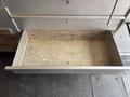 Empty metal drawer of a 2011 Workhorse W62 with a textured surface and no visible contents