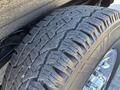 Close-up of a tire from a 2019 GMC Savana showcasing its tread pattern and rubber texture