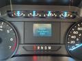Dashboard of a 2019 Ford F-150 displaying engine information and total hours with speedometer and gear indicator visible