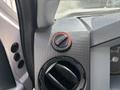 Close-up of a climate control knob in a 2011 Ford F-550 dashboard with an air vent below it