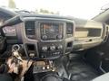 Dashboard of a 2016 RAM 5500 featuring a touchscreen display climate controls and various buttons along with keys hanging from the ignition switch