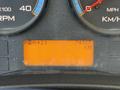 A digital dashboard display showing the odometer reading of 74927 kilometers on a 2013 International CE300 vehicle