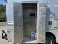 A silver 2008 Workhorse W62 food truck with open double doors revealing an empty interior with walls and a small platform on the floor