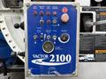 Control panel of a 2013 International Workstar 7500 featuring various buttons knobs and indicators for managing functions such as throttle load and auxiliary hydraulics