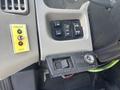 Interior control panel of a 2008 International 4400 featuring buttons for horn alert and auxiliary functions along with a Chelsea PTO switch