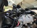 The image shows the engine compartment of a 2009 International 3000 CE with various hoses wires and components visible within the engine assembly