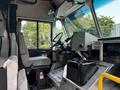 Interior view of a 2020 Freightliner MT45 showing the driver's seat steering wheel and dashboard controls
