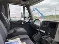 Interior view of a 2014 International Durastar truck focusing on the driver's seat and steering wheel with dashboard controls visible
