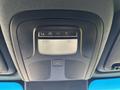 Ceiling control panel of a 2024 Mercedes-Benz Sprinter 2500 with buttons for communication and emergency services