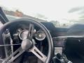Interior view of a 1968 Ford Mustang Two Door Convertible featuring a vintage steering wheel and dashboard with classic gauges and a modern infotainment screen