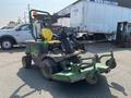 A 2012 John Deere 1445 Lawn Mower featuring a yellow seat and green body with mounted mowing decks and front attachments