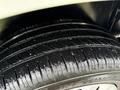 Close-up of a tire from a 2017 RAM ProMaster City showing tread pattern and water droplets on the surface
