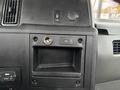 Interior dashboard of a 2020 International MV607 featuring a power outlet a USB port and a storage compartment