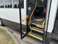 A 2020 Chevrolet Express with an open door and yellow stairs leading up into the vehicle