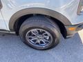 A close-up view of the wheel and tire of a 2023 Ford Bronco Sport showcasing the alloy rim and Continental tire