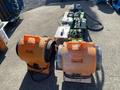 A collection of restoration equipment including two orange air movers, a green ventilator, a utility heater, and other related tools and devices
