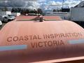A 2007 Fassmer 20 Foot Fast Rescue Boat with the text COASTAL INSPIRATION VICTORIA displayed on its hull