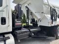 A 2013 International WorkStar truck showcasing hydraulic components and a large rear dump body designed for construction and heavy-duty work