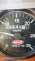 A close-up of a Peterbilt 335 gauge showing the hour meter at 6843 hours with a needle indicating RPM x 100