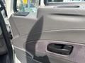 Interior door panel of a 2012 International 7300 Workstar with a door handle and control buttons