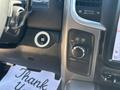 The interior dashboard of a 2018 RAM 3500 featuring a knob for four-wheel drive settings and a push-button engine start