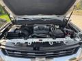 The image shows the engine bay of a 2017 Chevrolet Colorado with various components including the engine air filter and hoses visible