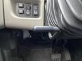 Interior controls and lever of a 2014 International Durastar truck showing buttons for mir panel and uhm along with a gear shift lever