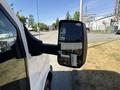 A side view mirror of a 2017 Chevrolet Express displaying its reflective surface and part of the van's body