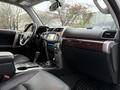 Interior of a 2018 Toyota 4Runner featuring a steering wheel dashboard and center console with controls and screen