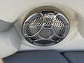 A circular chrome speaker grille with a mesh pattern designed for a 2013 Larson 238 boat