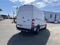 A 2010 Mercedes-Benz Sprinter van with a white exterior parked with its rear facing the viewer and featuring a distinctive Mercedes-Benz emblem