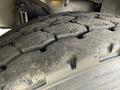 Close-up view of a worn tire tread from a 1996 Kenworth T800 revealing deep grooves and rugged texture