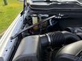 Engine compartment of a 2020 Ram 2500 showing the air intake hose and various engine components