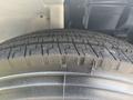 The image shows the tire of a 2012 Hino 338 with visible tread patterns and a close-up view of its surface details