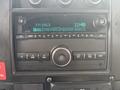 2020 Chevrolet Express dashboard displaying a digital radio with station information and control buttons