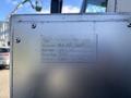 A metal plate attached to the side of a vehicle with details including equipment type, due date, and hours due