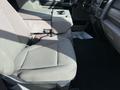 Interior view of a 2021 Ford F-250 SD showing front seats and a center console with cup holders