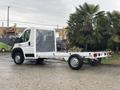 A 2023 RAM Promaster 3500 chassis cab with an open cargo area and a clear protective cover on the cab