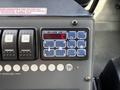 Control panel of a 2020 Mercedes-Benz Sprinter 2500 featuring various buttons and a digital display showing temperature and settings