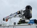 A 2024 RAM 5500 with an extended hydraulic boom and basket attached to the rear for lifting operations