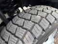 Close-up of a large tire tread from a 2017 Ford F-550 showing deep grooves and rugged surface designed for traction and durability