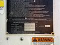 A metal label on an International 7500 vehicle displaying electrical insulation warnings and specifications for voltage and testing categories