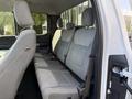 Interior view of the rear seats in a 2021 Ford F-150 featuring gray fabric upholstery and two headrests