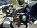 2006 Freightliner M2 106 engine compartment showing the air intake system cooling components and various hoses