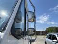 A close-up view of the side mirrors of a 2012 Ford Econoline van showcasing the vehicle's distinctive shape and design