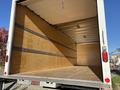 Interior of a 2022 Lion Lion6 truck showing a spacious empty cargo area with wooden walls and a wooden floor