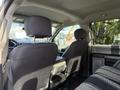 Interior view of a 2018 Ford F-150 showing the driver's and passenger's seat with a fabric pattern and headrests visible