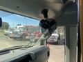 Interior view of a 2020 Chevrolet Express showing a mounted small black fan on the dashboard