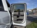 A 2018 Ford F-150 door is open displaying the interior handle and armrest with a two-tone color scheme and textured materials