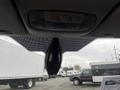 Interior view of a 2017 Ford Transit Connect showing the rearview mirror and overhead controls